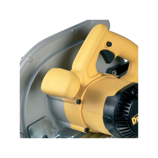 Close-up of a DEWALT yellow and black circular saw handle and motor housing.