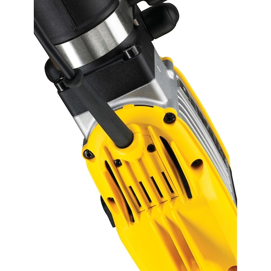 Close-up view of a DEWALT power tool, showing a yellow and black housing with metal components and air vents.