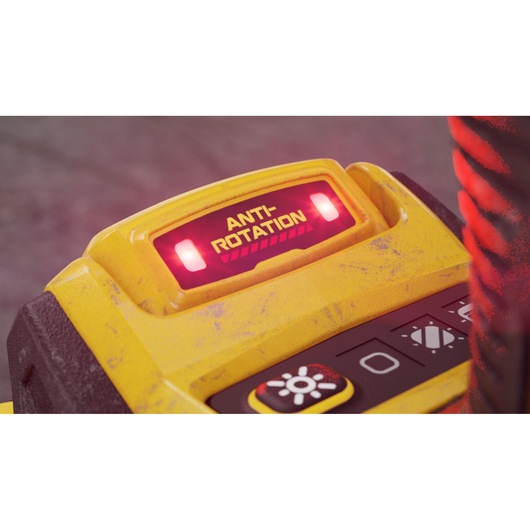 Close-up view of a yellow DEWALT device, showing a lit red indicator labeled 'ANTI-ROTATION' and some control buttons below.