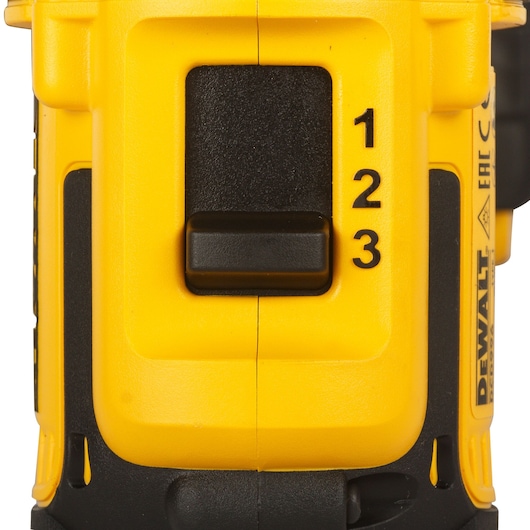 Close-up of a yellow and black DEWALT cordless drill showing the speed selection switch with numbers 1, 2, and 3.