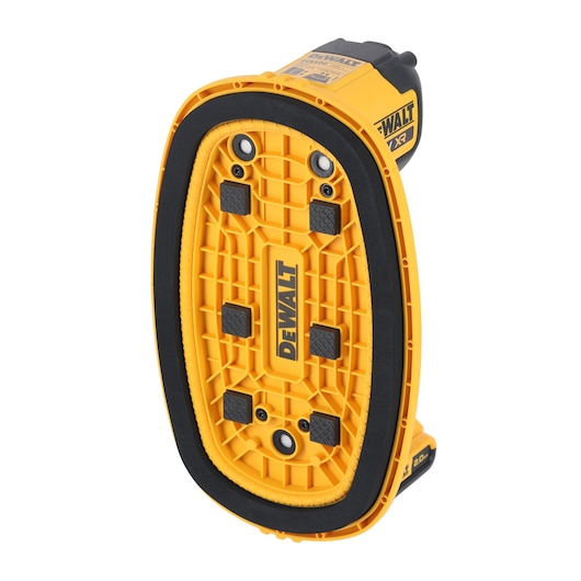 A yellow and black DEWALT power tool, viewed from the bottom. The tool features a textured, oval-shaped base with multiple screw holes and black grip pads. The DEWALT logo is visible in the center.