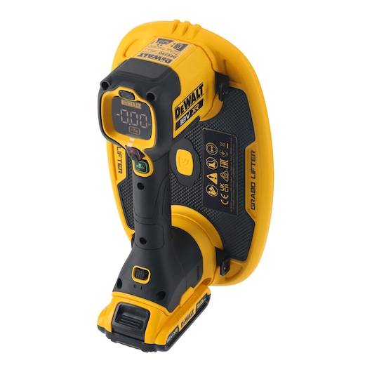A DEWALT 18V XR Grabo Lifter tool shown from an angled perspective. The device is yellow and black with visible control buttons, a digital display, and functional labels. It is designed for lifting and handling materials using suction technology.