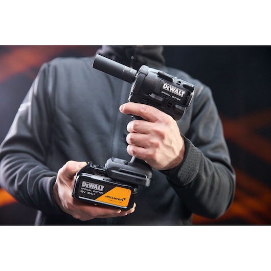 DEWALT tool held in hand. SKUs: DCF92MP2T-QW, DCF92MP2T. Photography category.