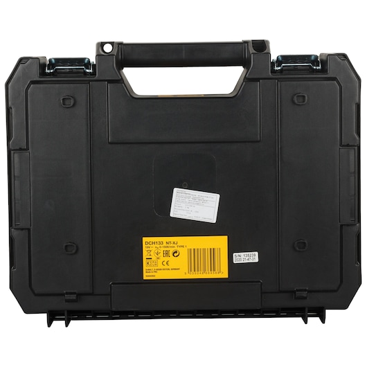A black DEWALT hard carrying case with a handle, shown closed. It features a yellow label with product information DCH133NT-XJ and a barcode, along with certification markings and a serial number sticker.