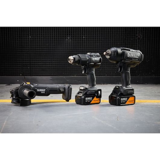 DEWALT tools set, SKUs DCK3222MP2T-QW and DCK3222MP2T for photography. Three cordless power tools on floor.