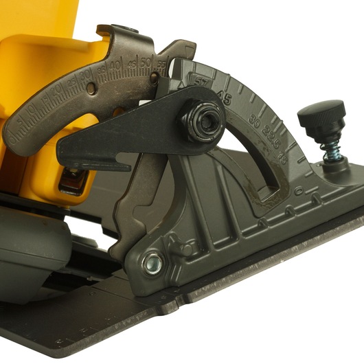 Close-up of the angle adjustment mechanism and scale on a DEWALT circular saw, showing the metal parts and numbered angle markings.