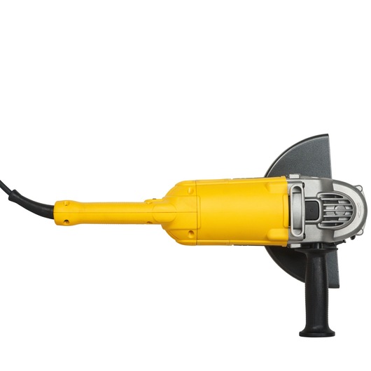 Yellow DEWALT DWE492 angle grinder with side handle and power cord, viewed from the side on a white background.