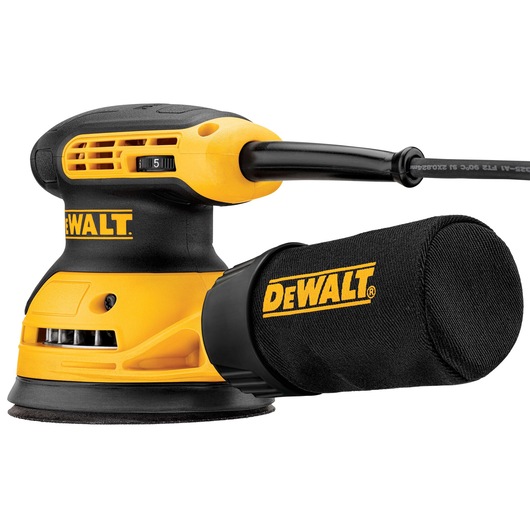 A close-up view of a DEWALT random orbital sander with a dust collection bag attached, featuring a yellow and black design and a power cord.