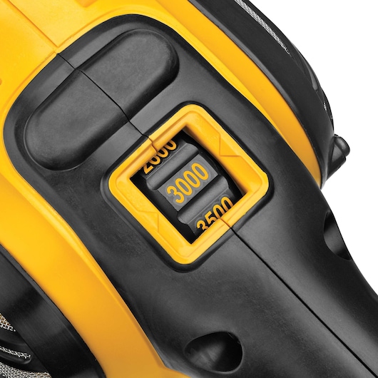 Close-up of a DEWALT power tool showing a black and yellow rotation speed dial with numbers 2500, 3000, and 3500.