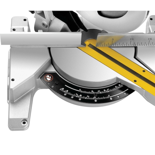 Close-up of a DEWALT DWS778 miter saw with angle and ruler markings visible.