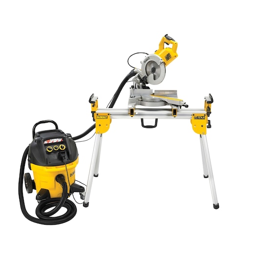 DEWALT miter saw on a stand with attached dust extractor, both in yellow and black, against a white background.