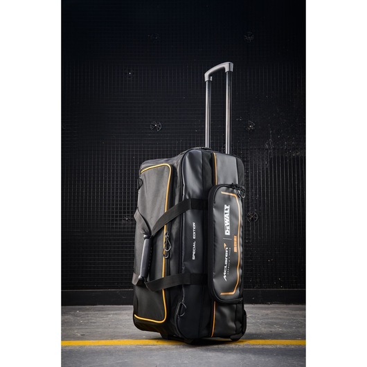 DEWALT rolling duffel bag with telescoping handle for tool transport and storage.